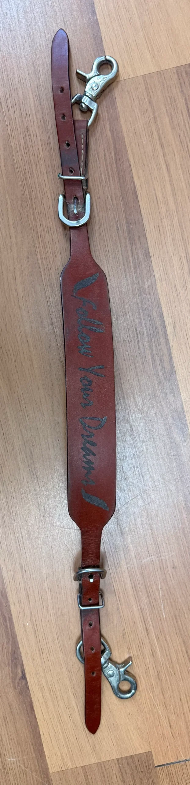 western saddle strap "follow your dreams"